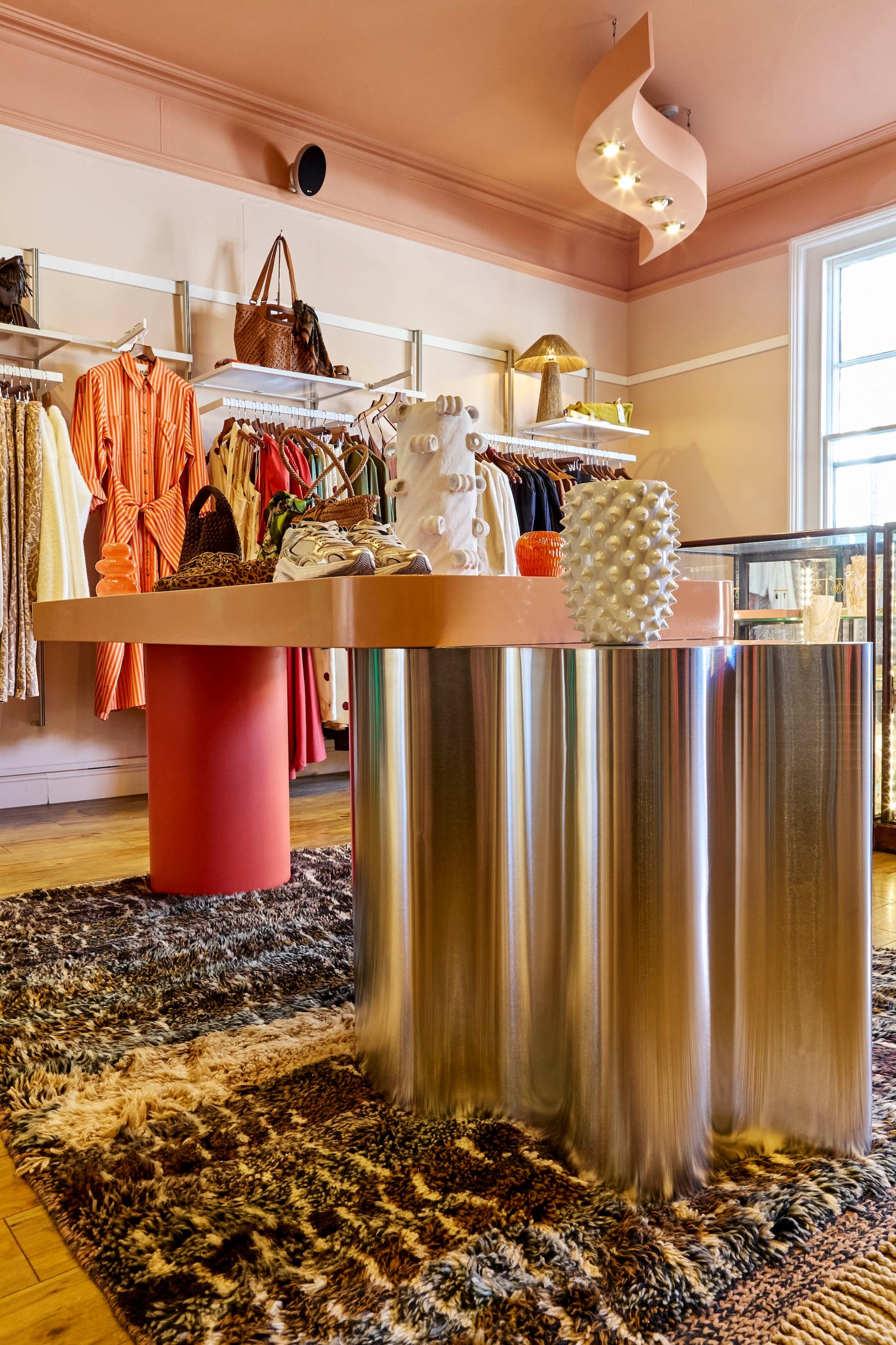 Colour drenched ceiling. Contemporary retail bespoke furniture.