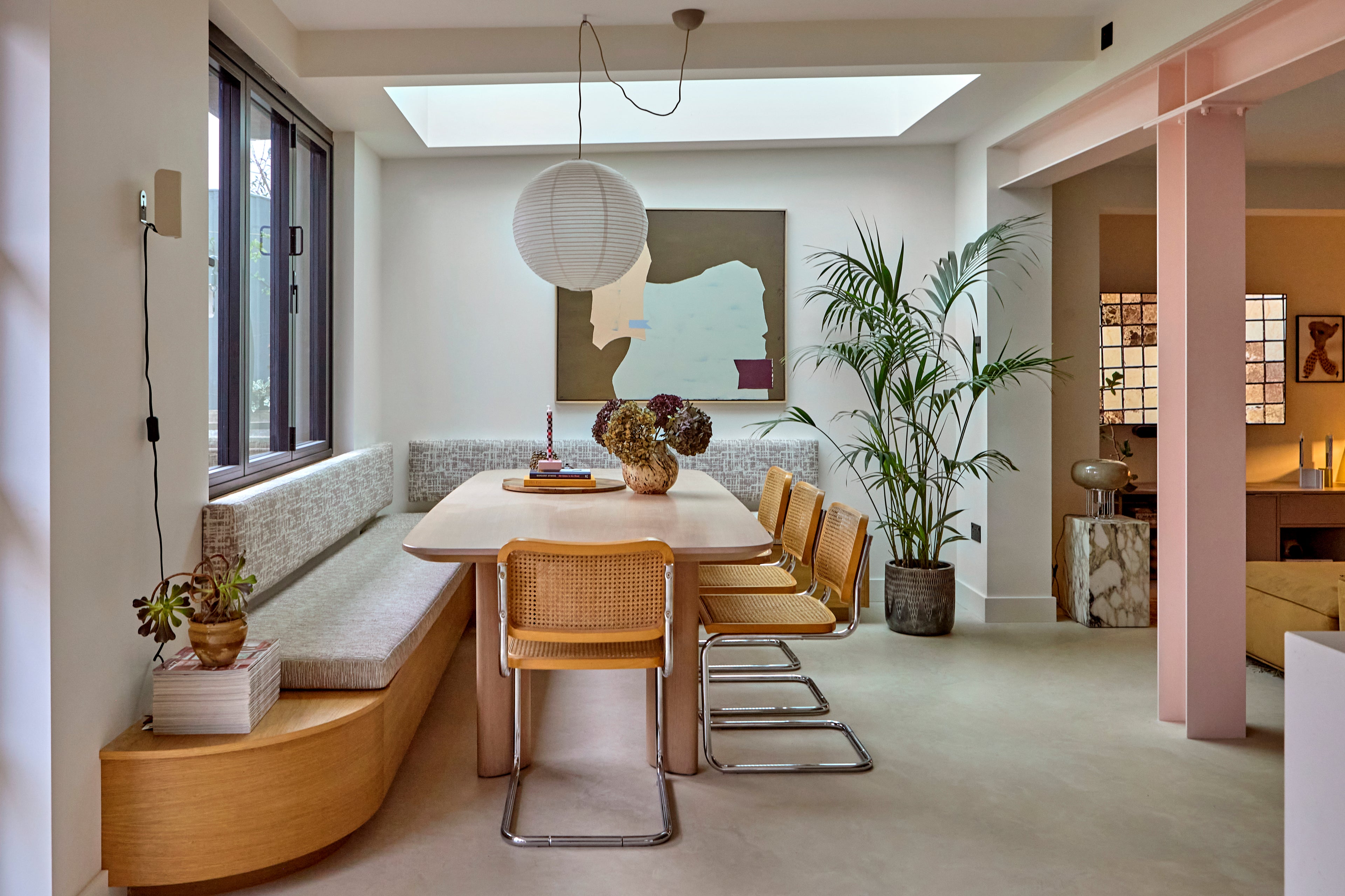 Contemporary dining space with vintage chairs