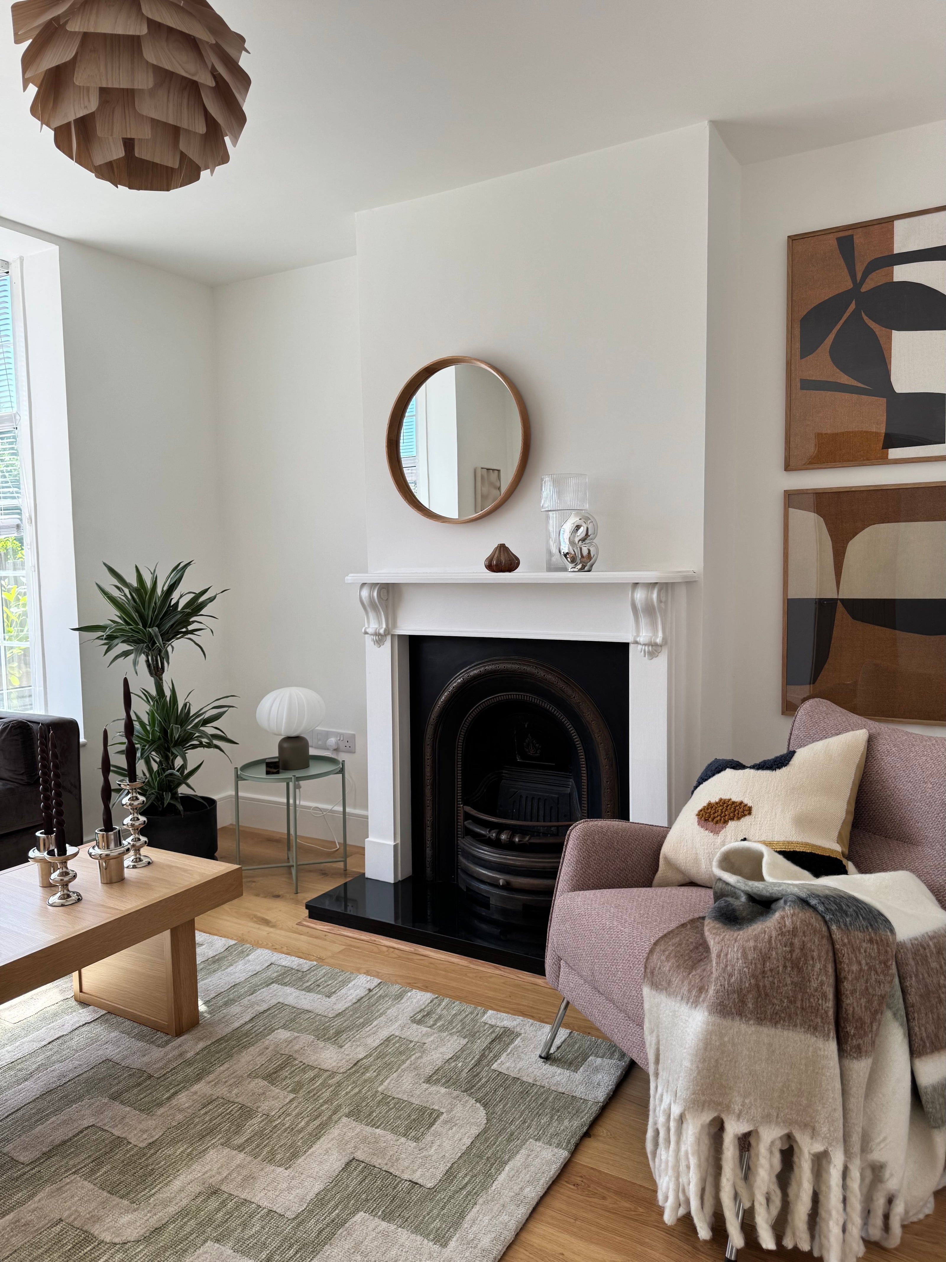 Ferm Living cushions, HK Living glass chrome vase, Artwork by Postery, Candles and silver candle holders by H&M