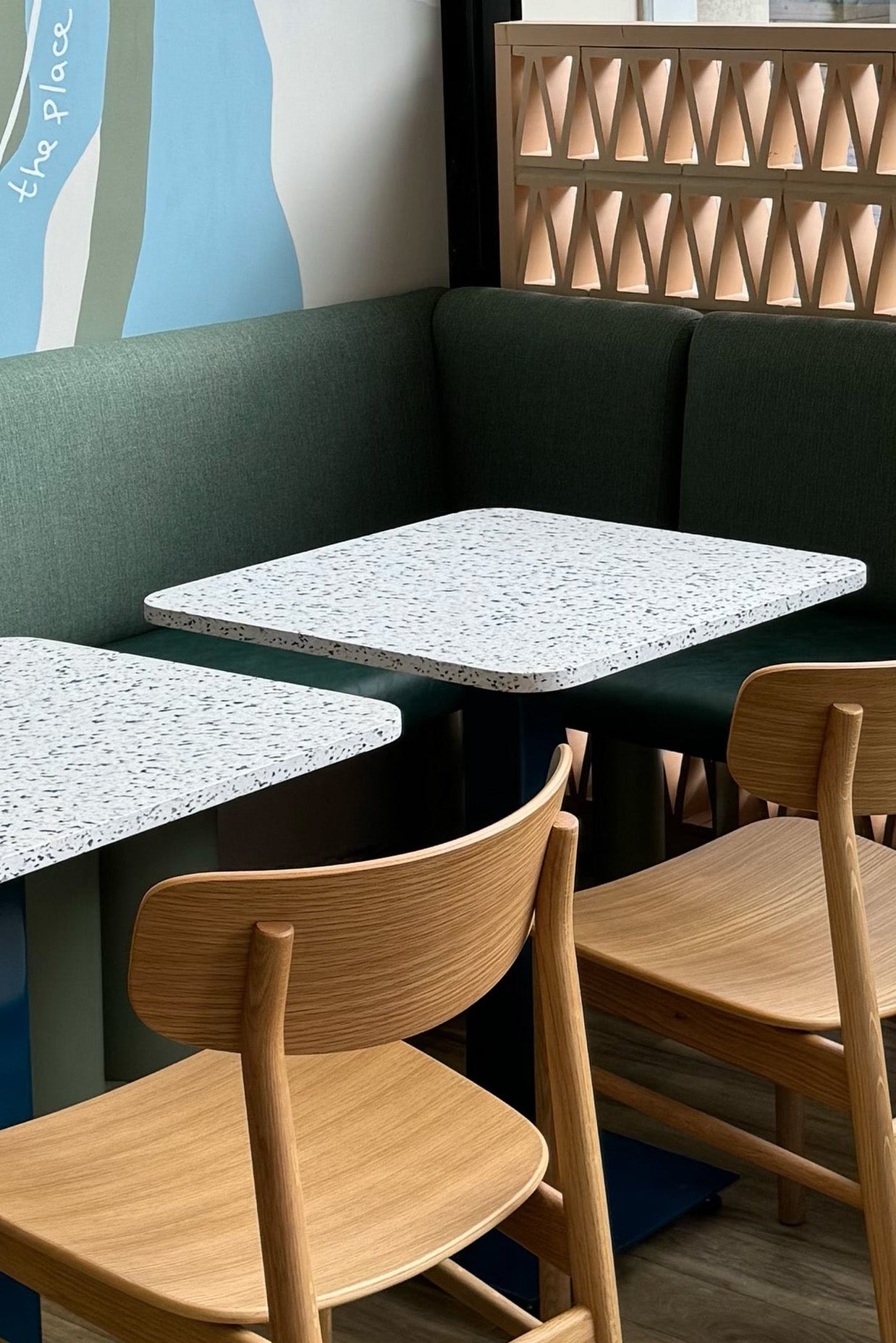 Smile plastics table tops, Muji chairs, bespoke banquette